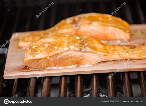 grilling salmon on a cedar plank on a gas grill